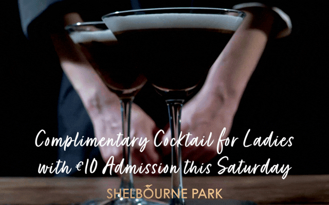 Image is a gif with a flashing neon sign with the words ladies day against a dark background with a moving image of a barman and 2 cocktails and text highlighting the free cocktail offer in Shelbourne Park on Saturday 22nd August