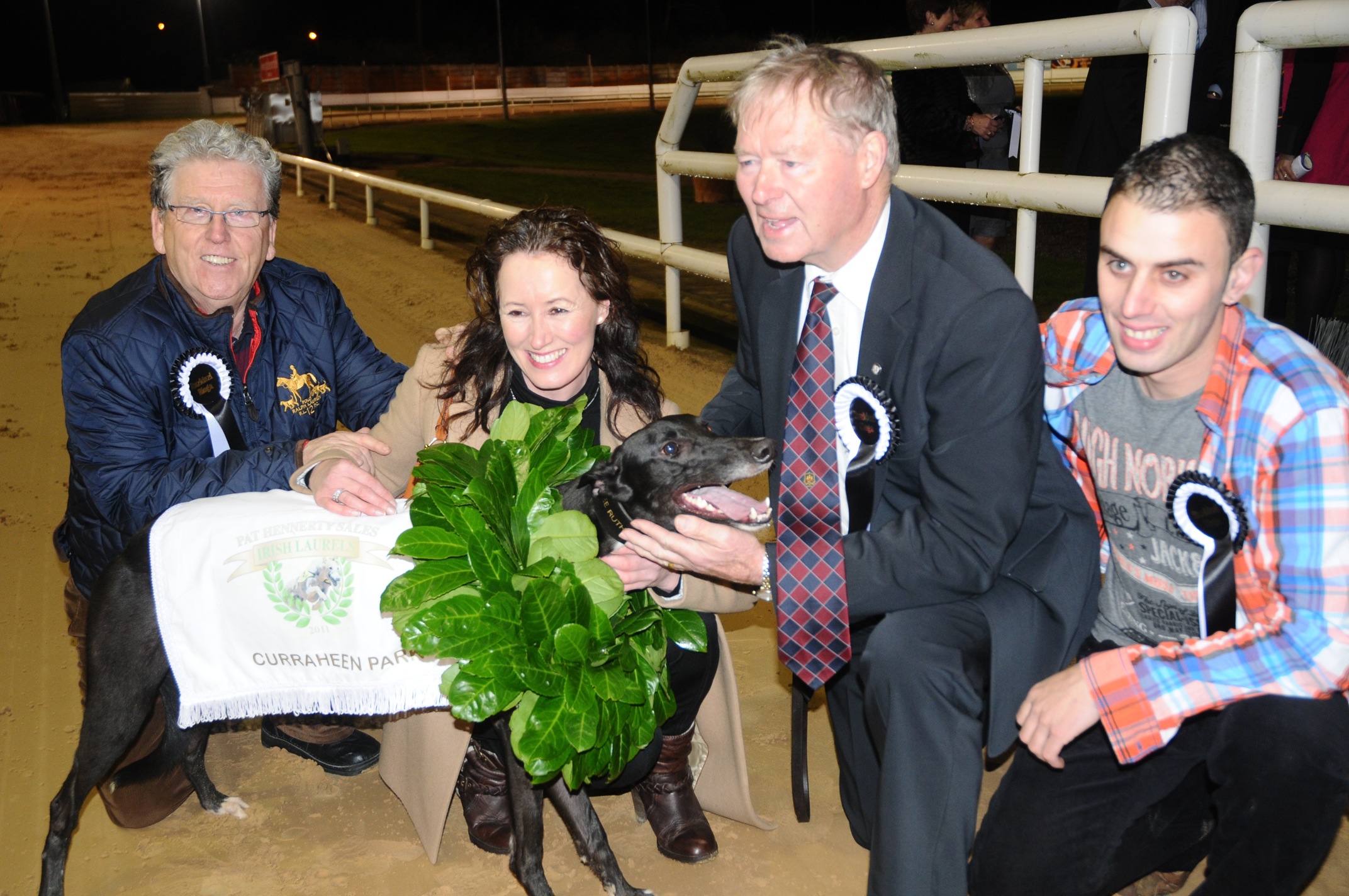 Michéal O' Muircheartaigh following his win in the Irish Laurels in Curraheen Park with his dog Razldazl Rioga, pictured with Dolores Ruth and Liam Marks.