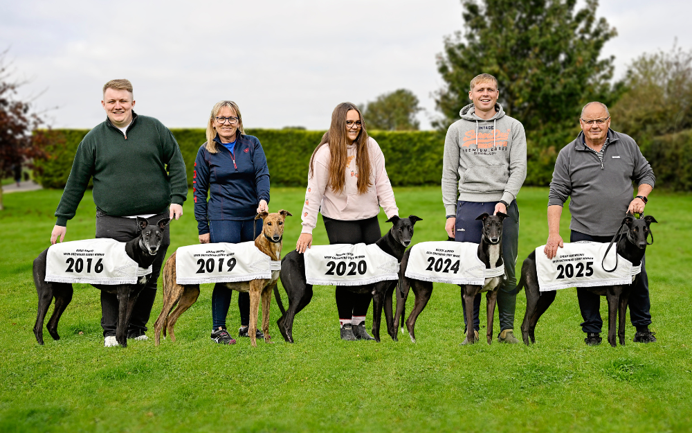 The Holland Family pictured at their Tipperary home in Riverside Kennels with their record breaking 5 Irish Greyhound Derby winners. Chris with 2016 champion, Rural Hawaii, Nicky with 2019 champion Lenson Bocko, Rachel with 2020 champion Newinn Taylor, Timmy with 2024 champion Bockos Diamond and Graham with 2025 champion Cheap Sandwiches. Image shows 5 people holding 5 greyhounds in a green field area with a hedge behind them. The Holland Family pictured at their Tipperary home in Riverside Kennels with their record breaking 5 Irish Greyhound Derby winners. Chris with 2016 champion, Rural Hawaii, Nicky with 2019 champion Lenson Bocko, Rachel with 2020 champion Newinn Taylor, Timmy with 2024 champion Bockos Diamond and Graham with 2025 champion Cheap Sandwiches. Pic courtesy of Greyhound Racing Ireland