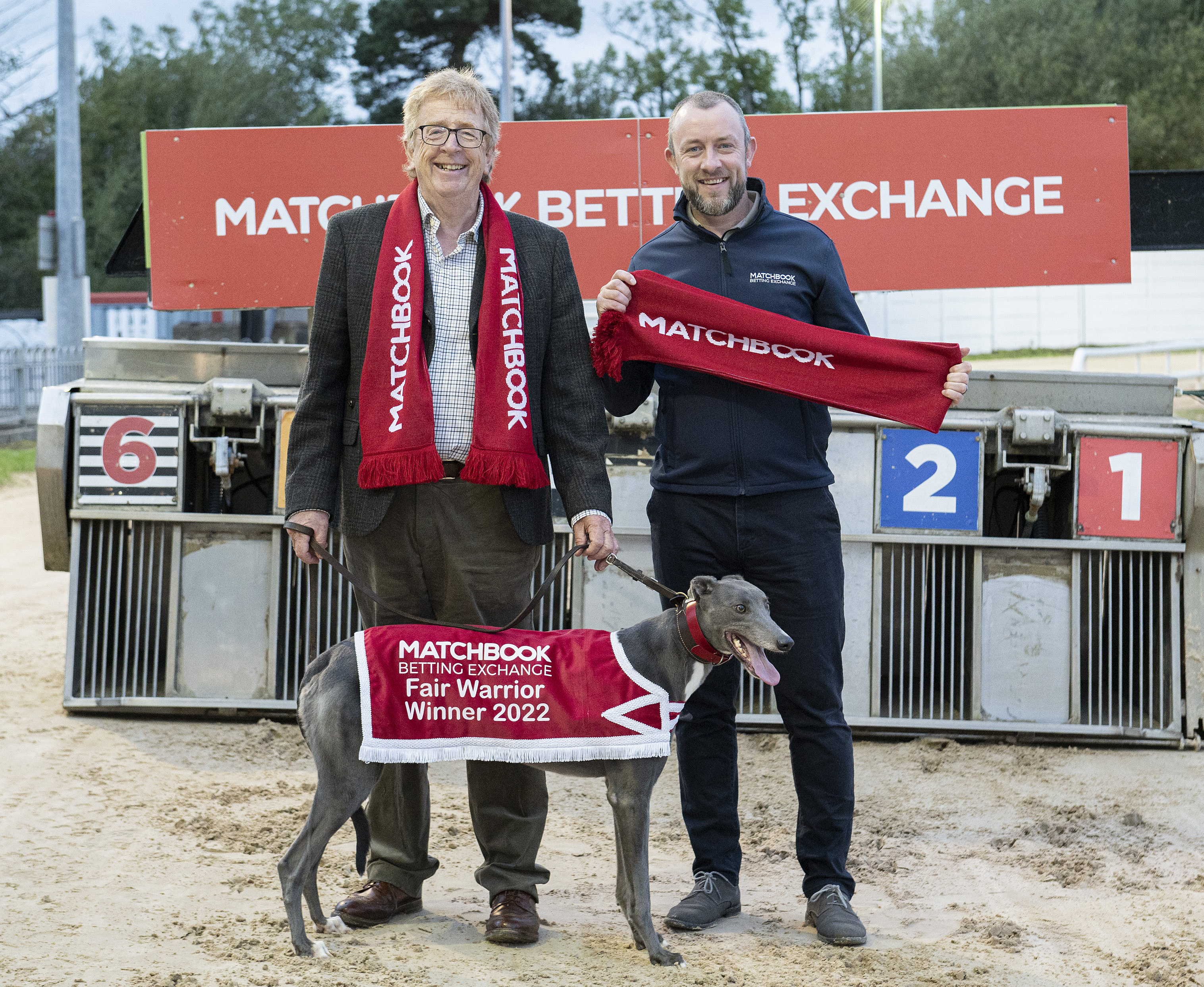 Frank Nyhan, Chairman of Greyhound Racing Ireland, pictured with Paul Geasley, Brand Manager of Matchbook Betting Exchange, and retired Greyhound Setella, to launch the Matchbook Betting Echange sponsorship of the Fair Warrior in Mullingar Greyhound Stadium